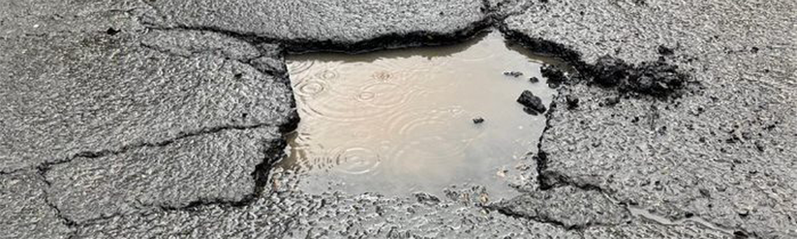 fixing-local-roads-pothole-hero.png